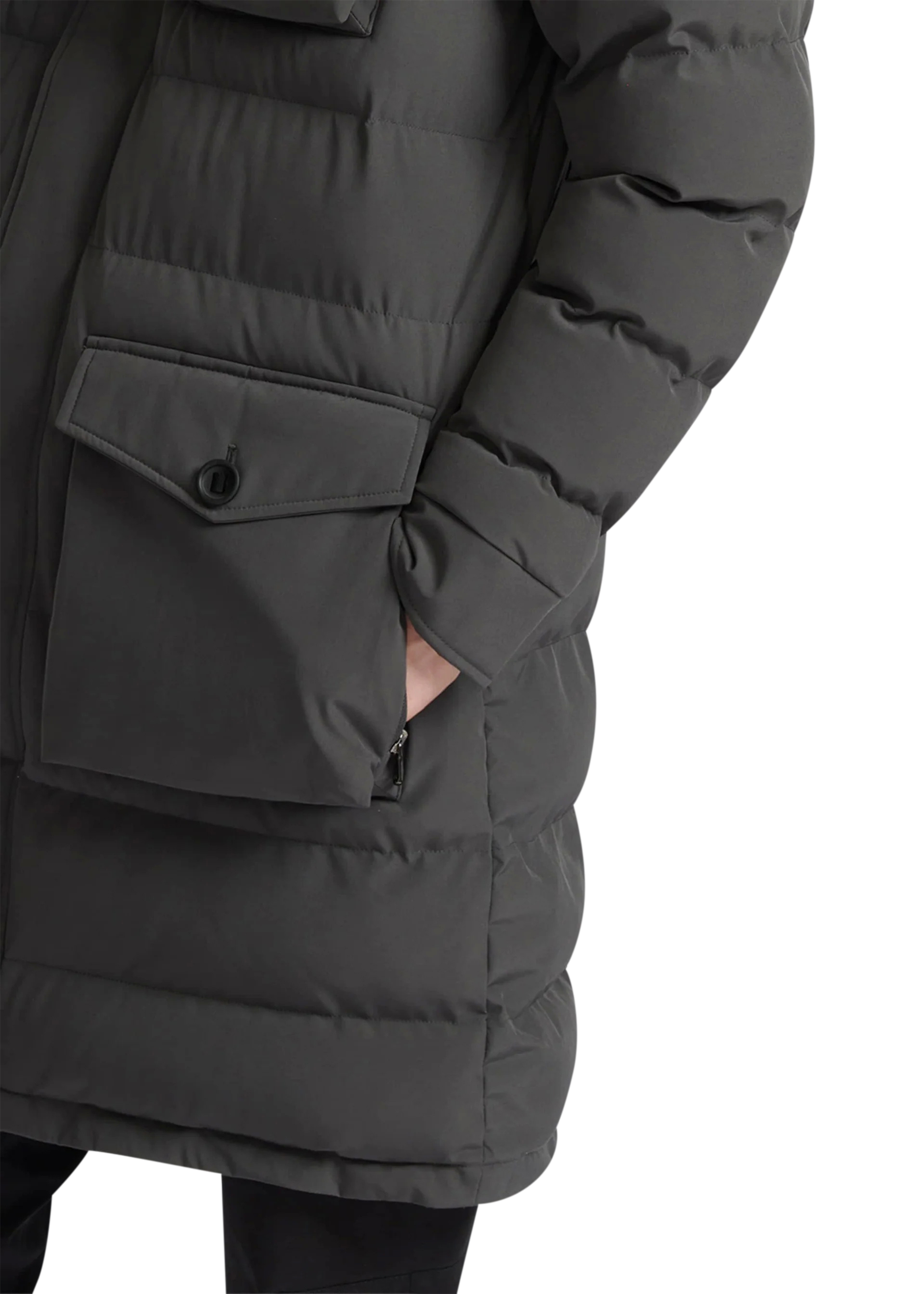 Close-up of a dark gray puffer jacket with front pocket on a white background