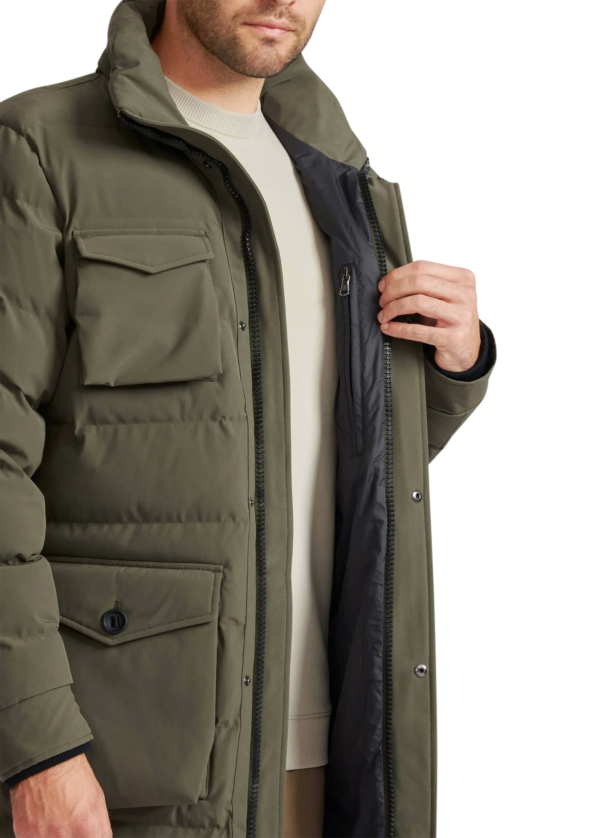 Person wearing a green jacket with a white background