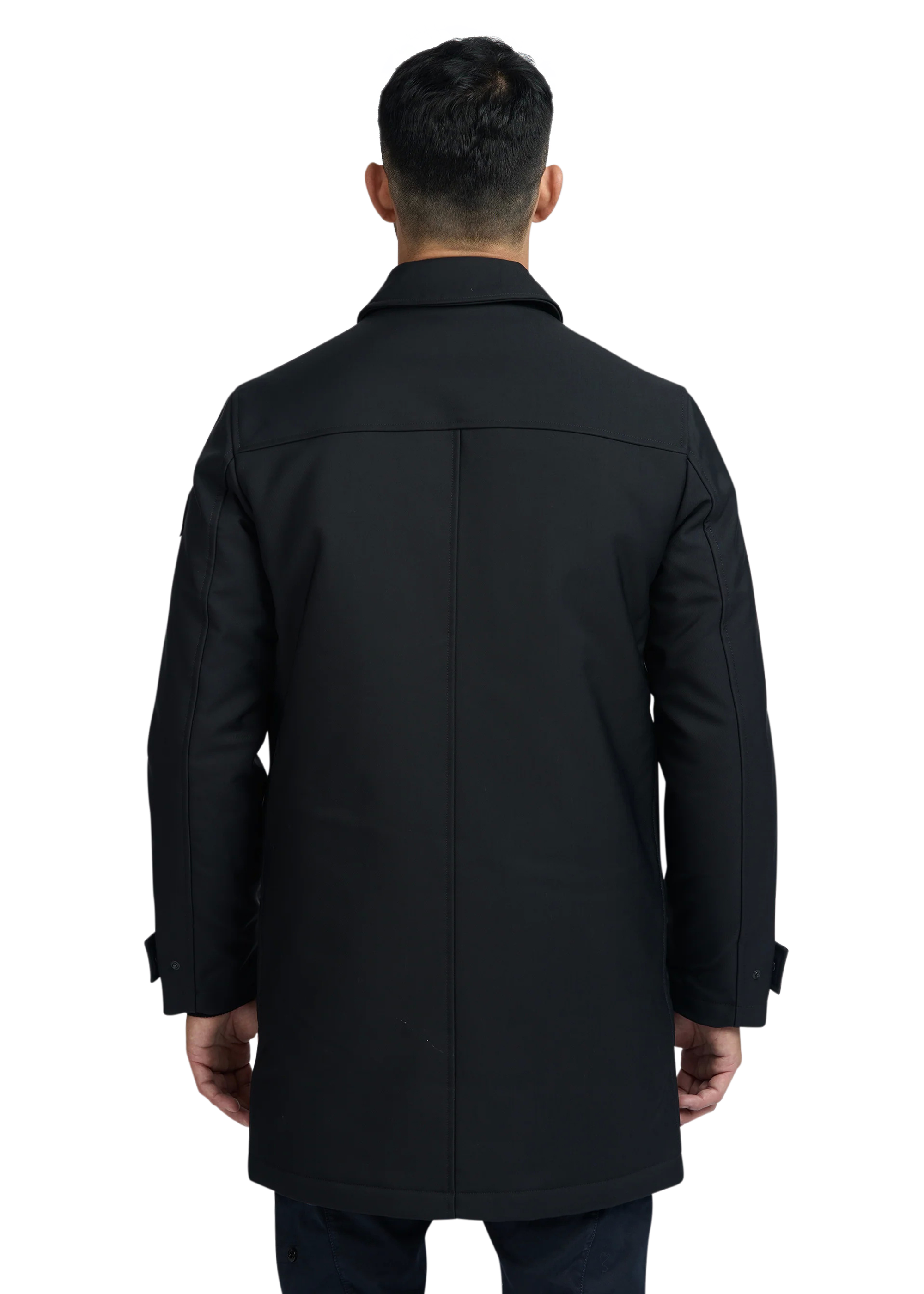 Man wearing a black coat from behind on a white background