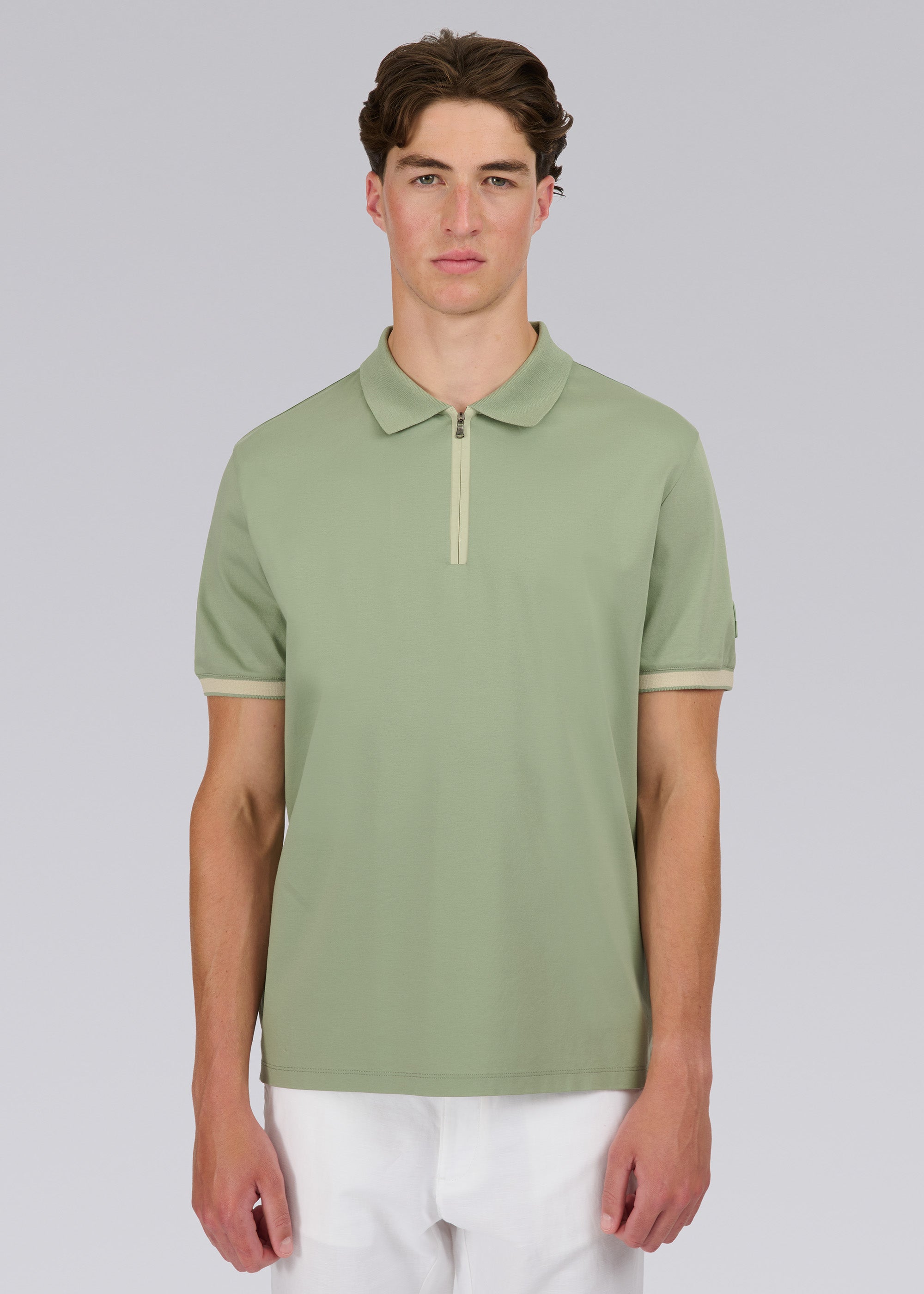 Model wearing Sandbanks Silicone Zip Polo Shirt - Sage