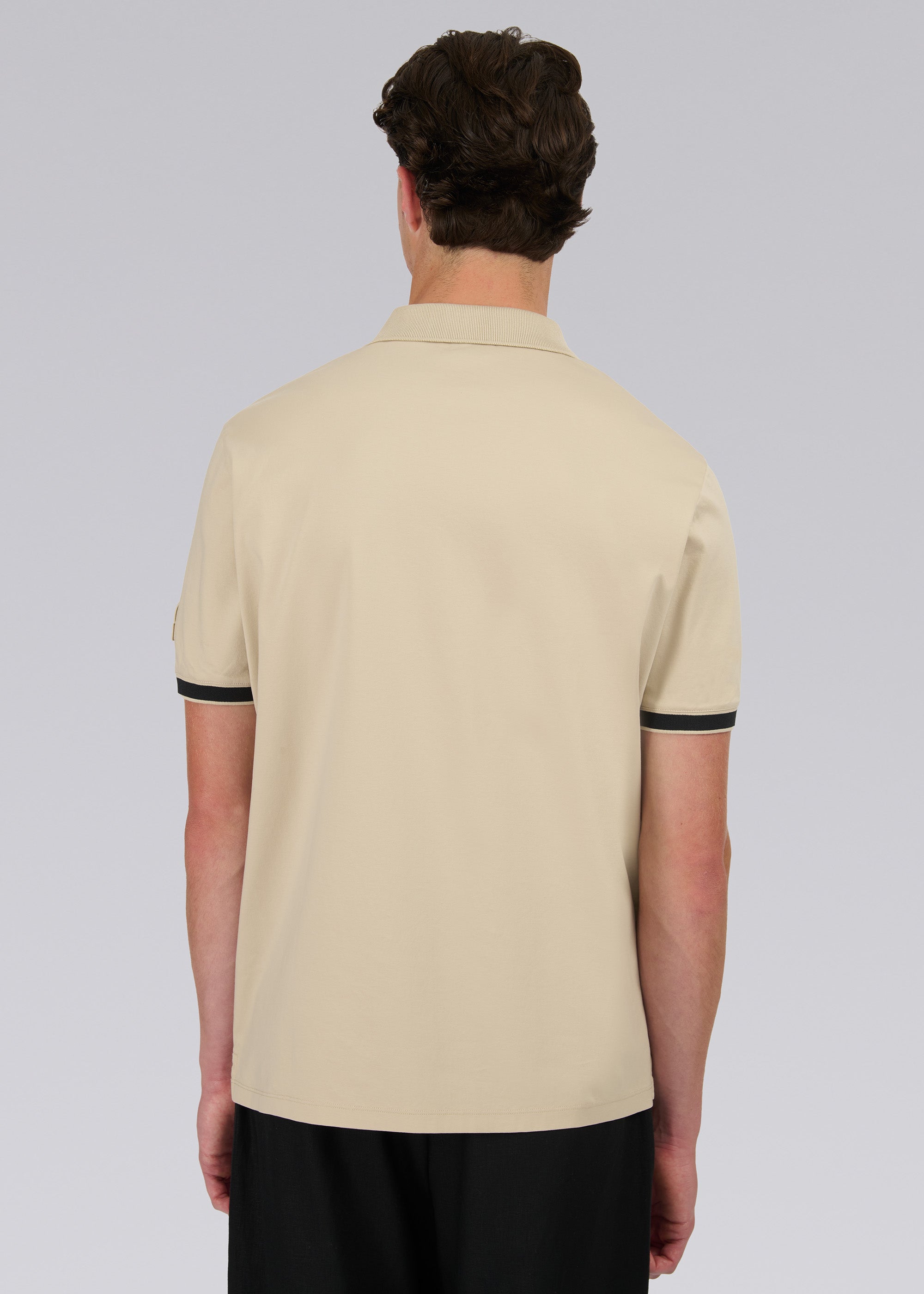 Model wearing Sandbanks Silicone Zip Polo Shirt - Stone