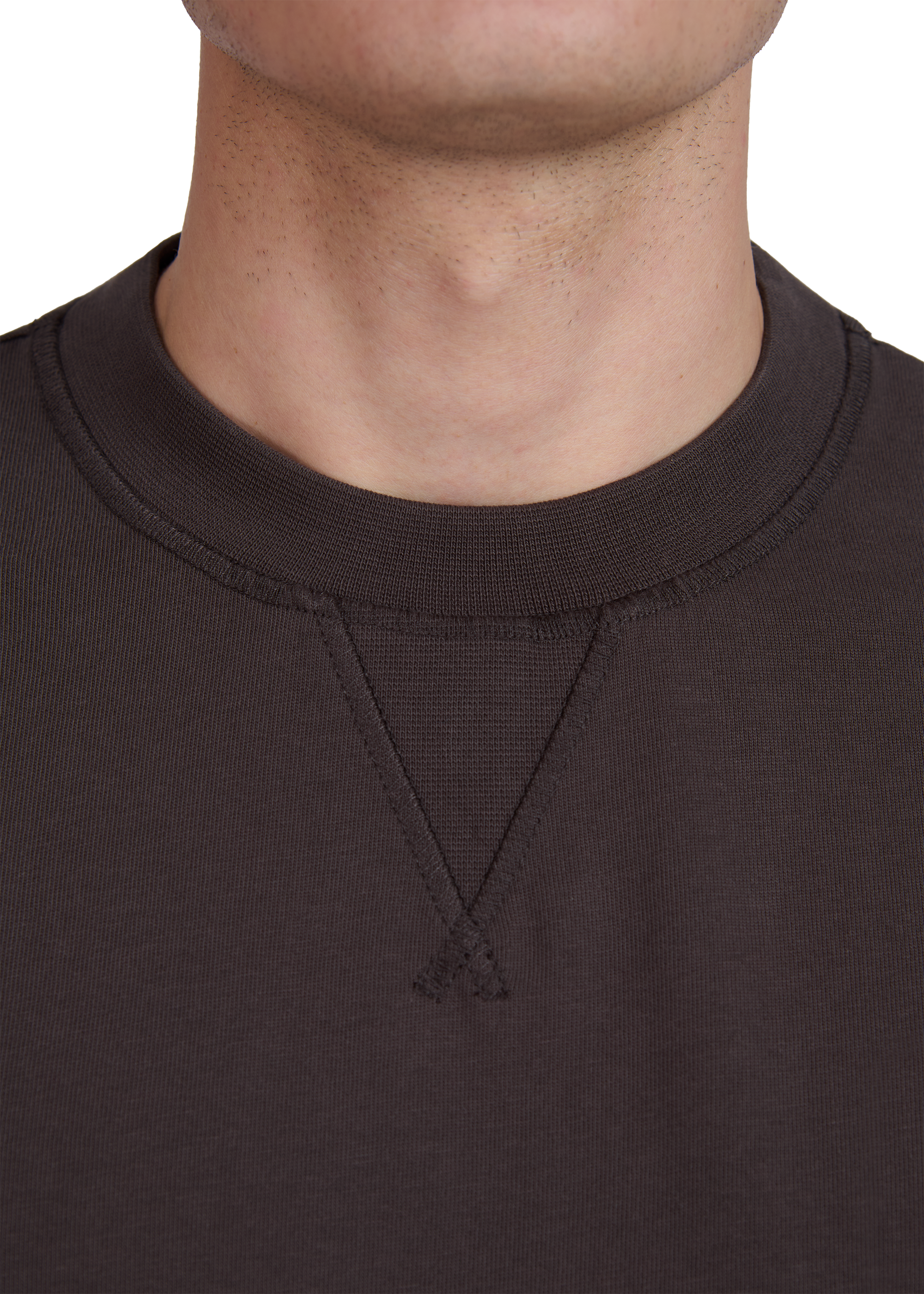 Close-up of a model wearing a dark brown sweatshirt with a V-neck design.