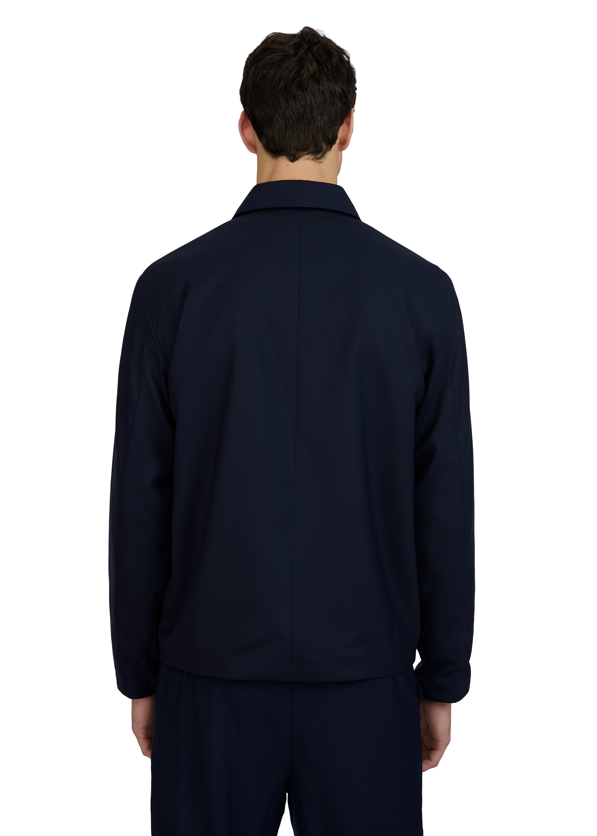 Person wearing a navy blue jacket on a white background