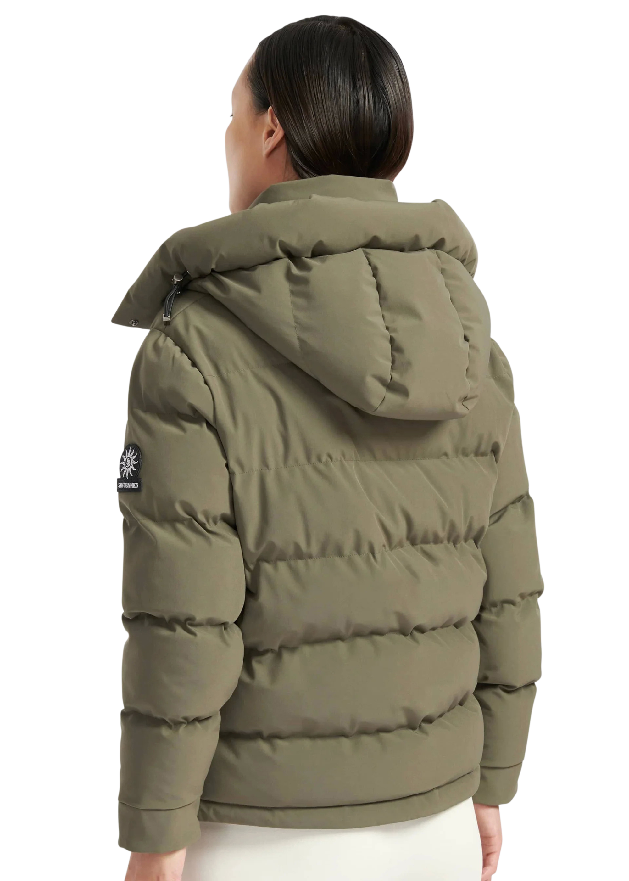 Person wearing a green puffer jacket with a hood on a white background