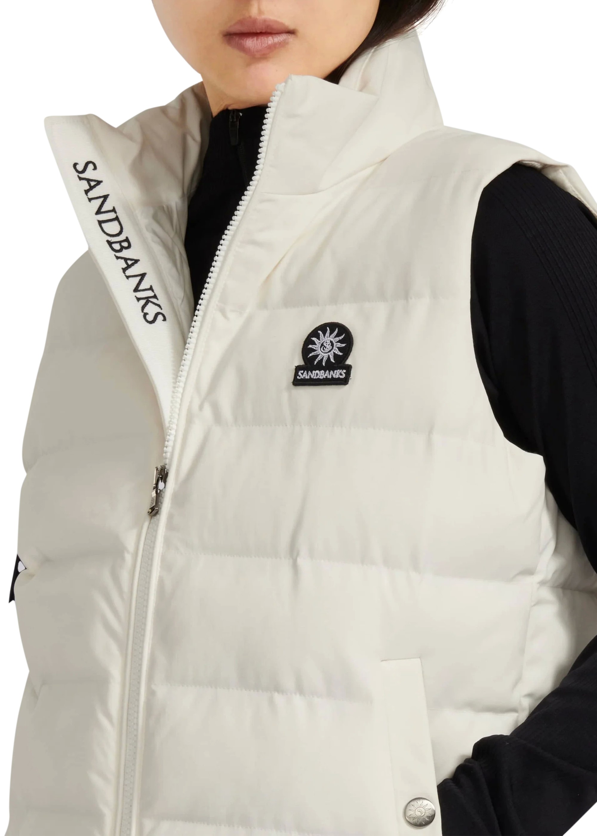 White puffer vest with Sandbanks branding on a white background