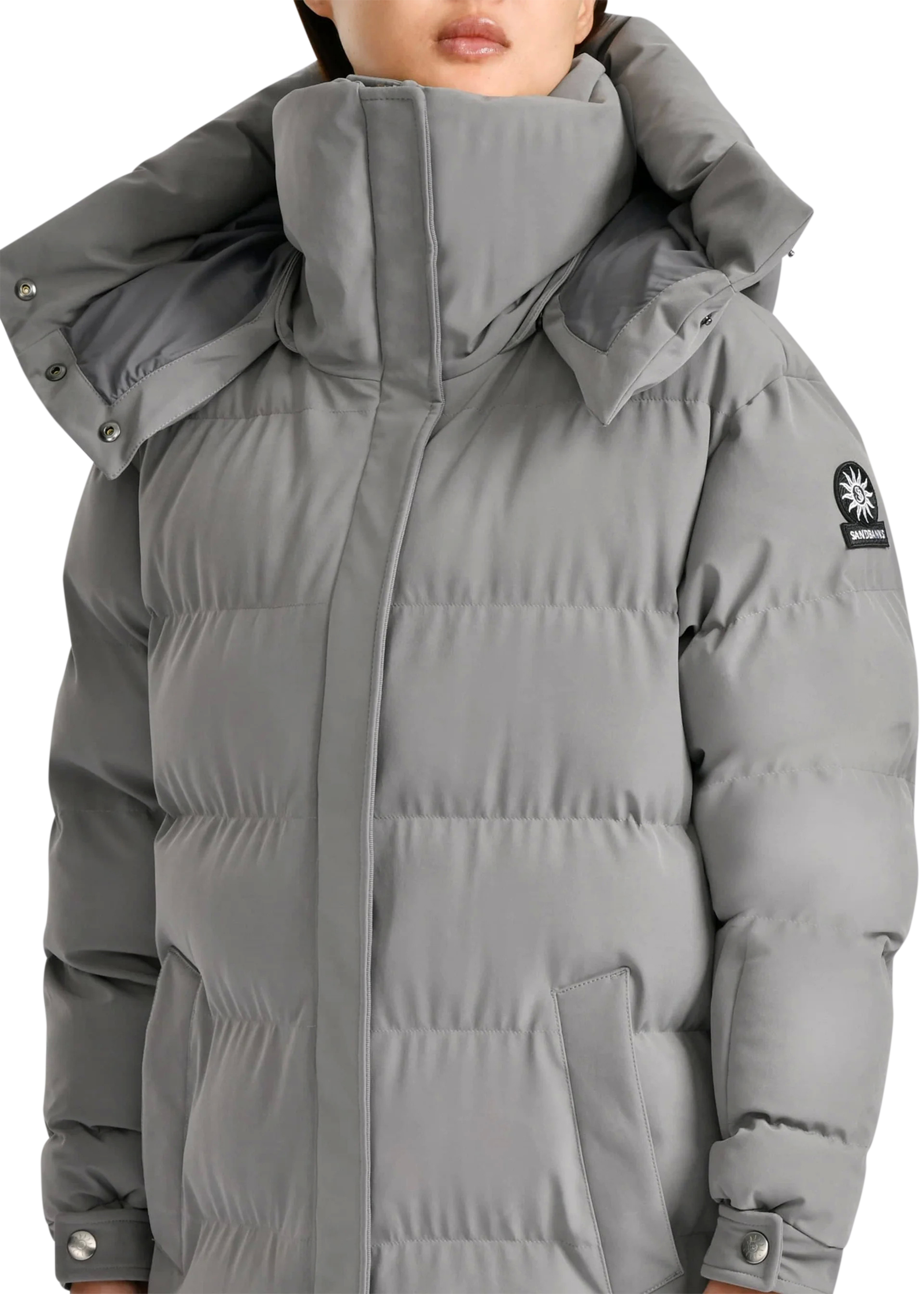 Gray puffer coat with a brand logo on a white background