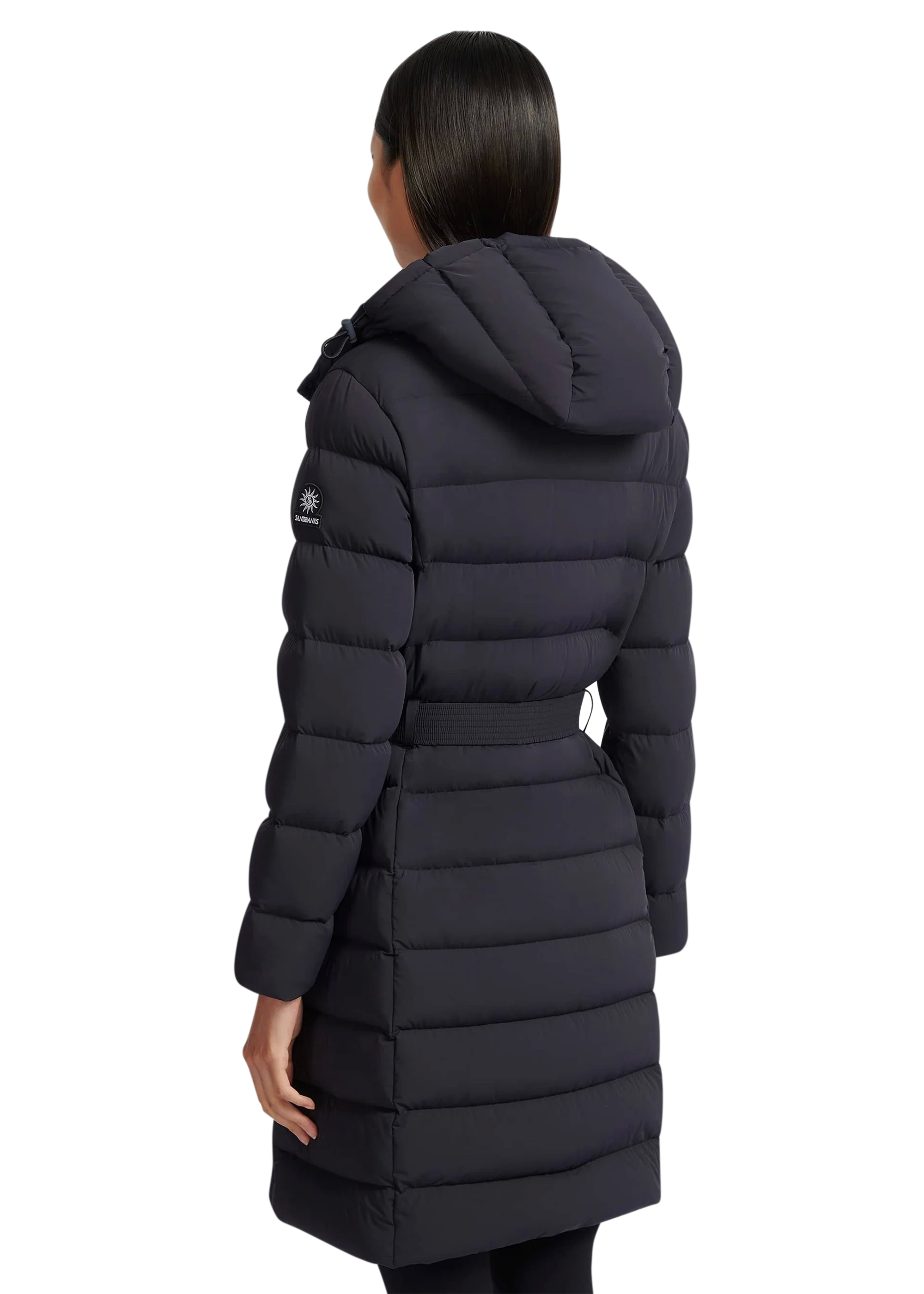 Person wearing a black puffer coat on a white background