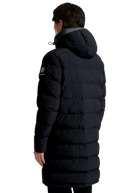 Person wearing a black puffer coat on a white background