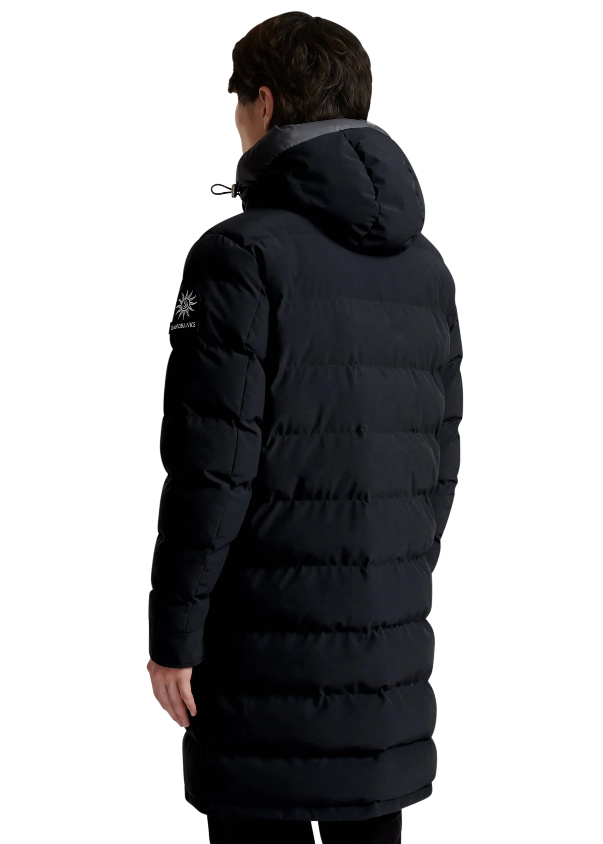 Person wearing a black puffer coat on a white background
