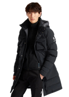 Person wearing a black winter coat with a brand logo on a white background