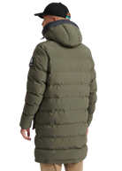 Person wearing a long green puffer coat on a white background