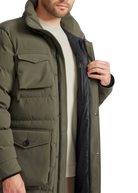 Person wearing a green jacket with a white background