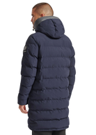 Man wearing a navy blue puffer jacket on a white background