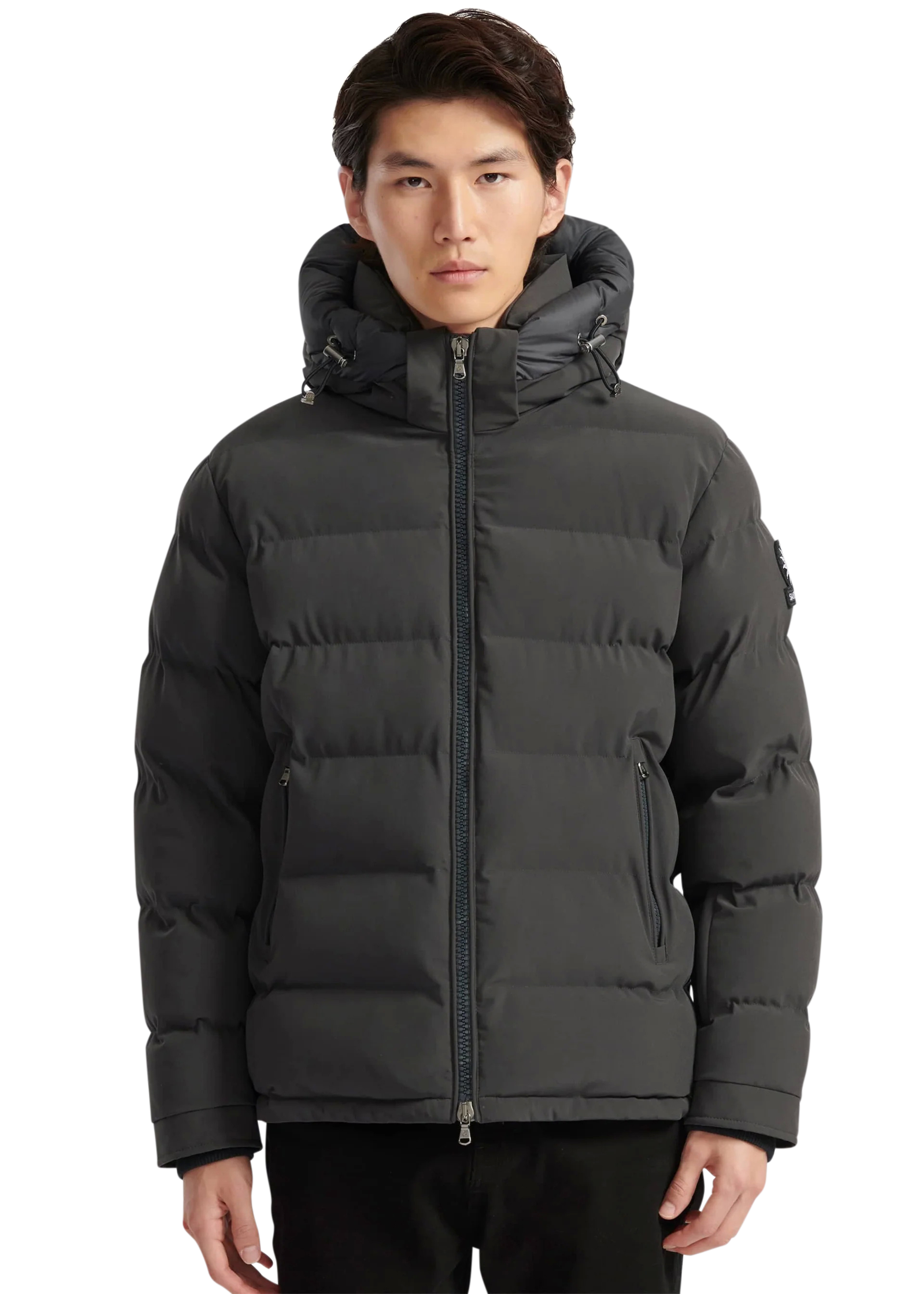 Man wearing a black puffer jacket on a white background