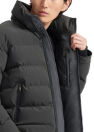 Person wearing a black winter coat with a brand logo on a white background