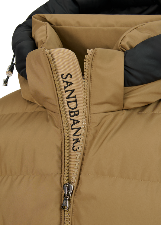 Close-up of a brown and black jacket with a hood on a white background