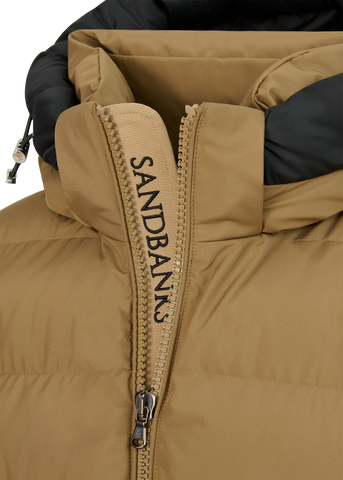 Close-up of a brown and black jacket with a hood on a white background