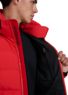 Person wearing a red jacket with 'Sandbanks' branding on a white background