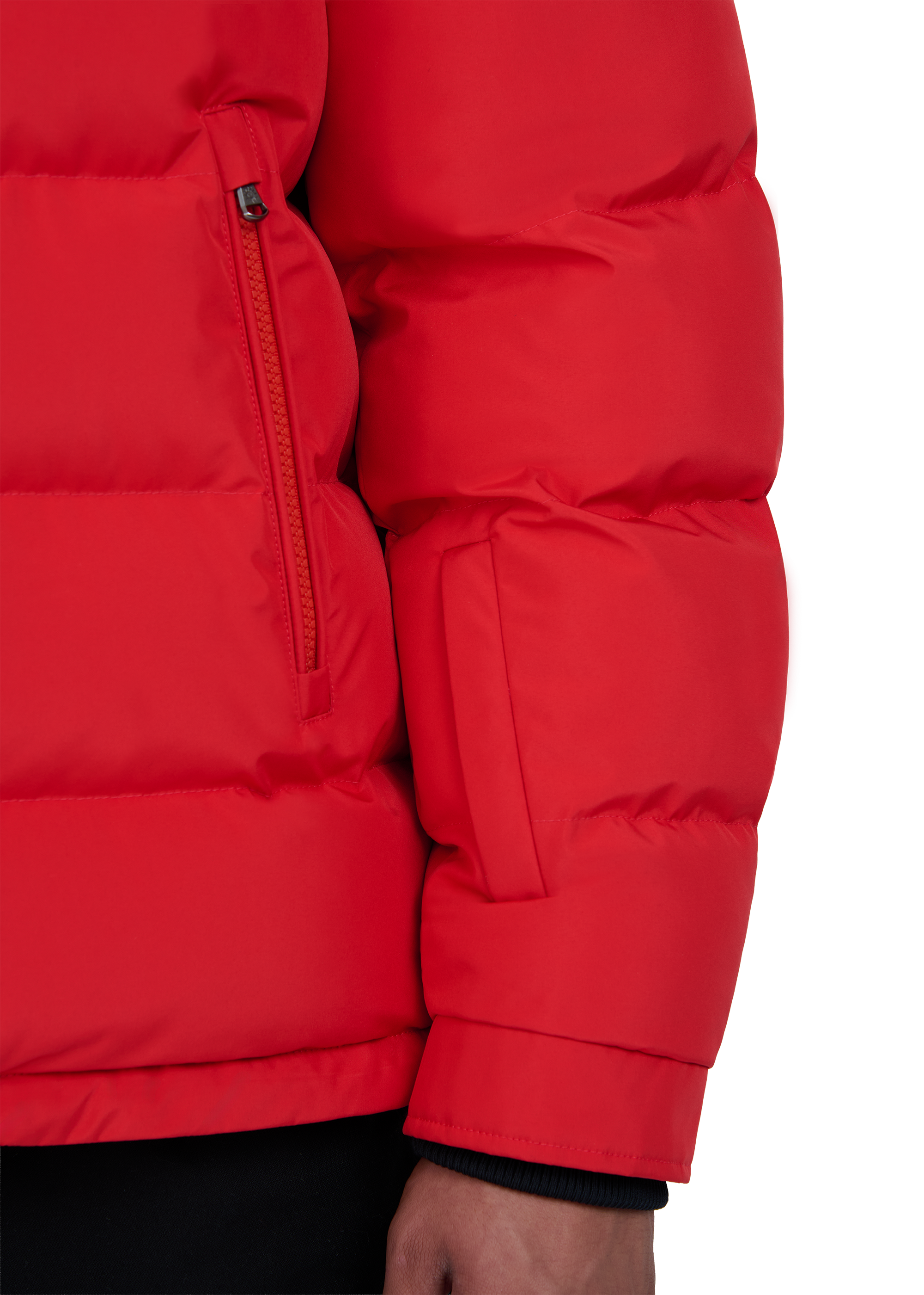 Close-up of a red puffer jacket on a white background
