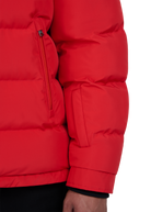 Close-up of a red puffer jacket on a white background