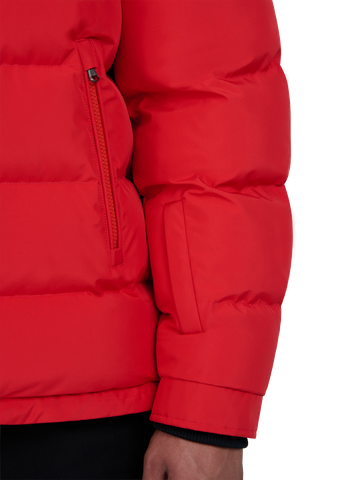 Close-up of a red puffer jacket on a white background