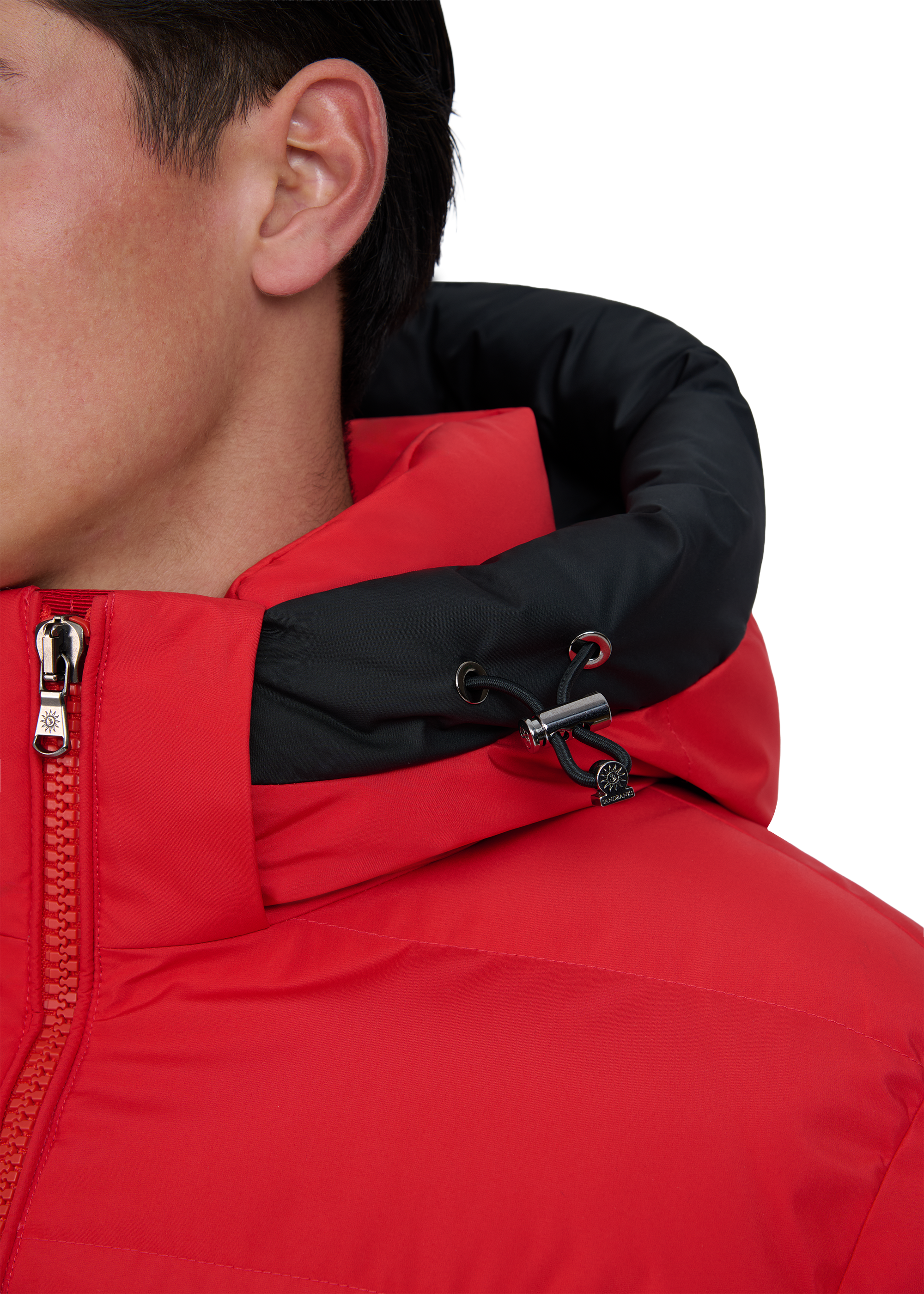 Close-up of a red and black jacket with a zipper on a white background
