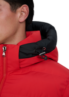 Close-up of a red and black jacket with a zipper on a white background