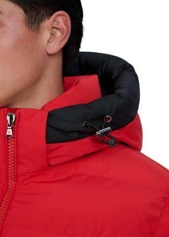 Close-up of a red and black jacket with a zipper on a white background