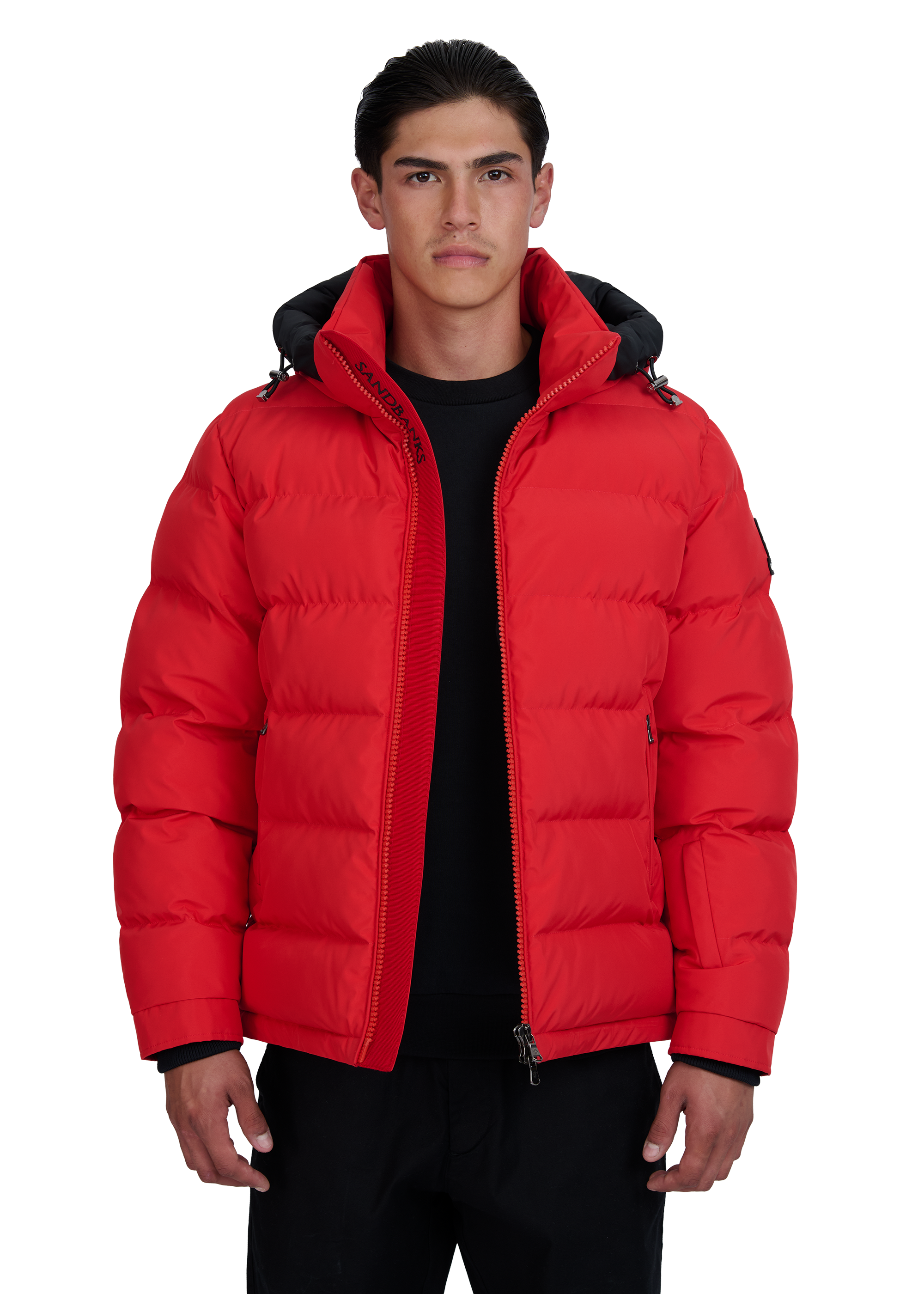 Man wearing a red puffer jacket on a white background
