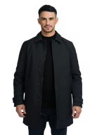Man wearing a black coat on a white background