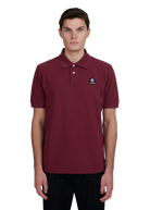 Model wearing Sandbanks Badge Logo Pique Polo Shirt - Port