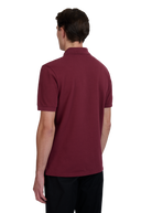 Model wearing Sandbanks Badge Logo Pique Polo Shirt - Port