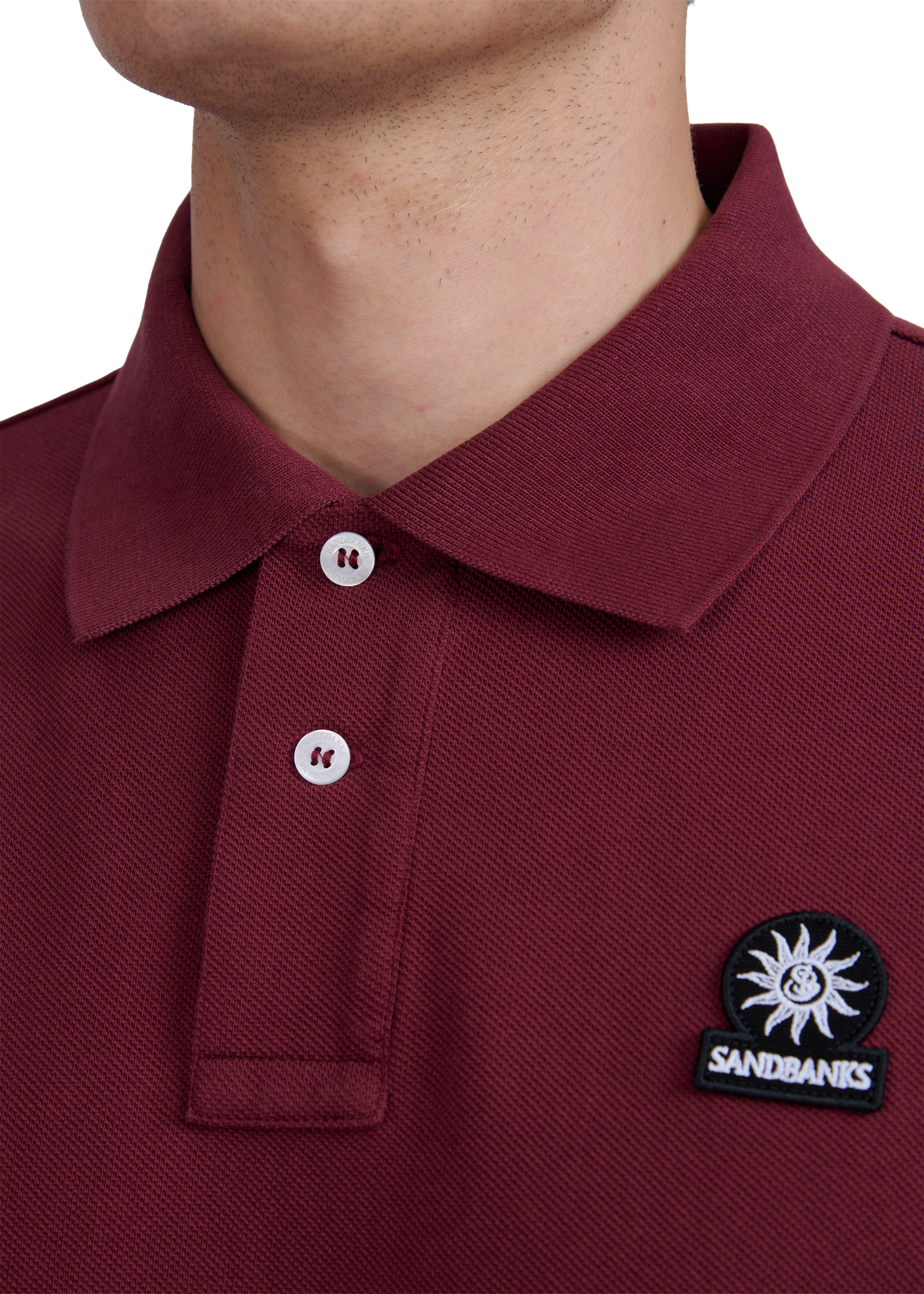 Model wearing Sandbanks Badge Logo Pique Polo Shirt - Port