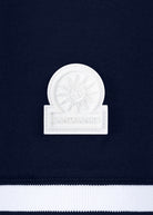 White emblem with 'Sandbanks' text on a navy background
