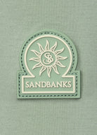 Model wearing Sandbanks Silicone Zip Polo Shirt - Sage