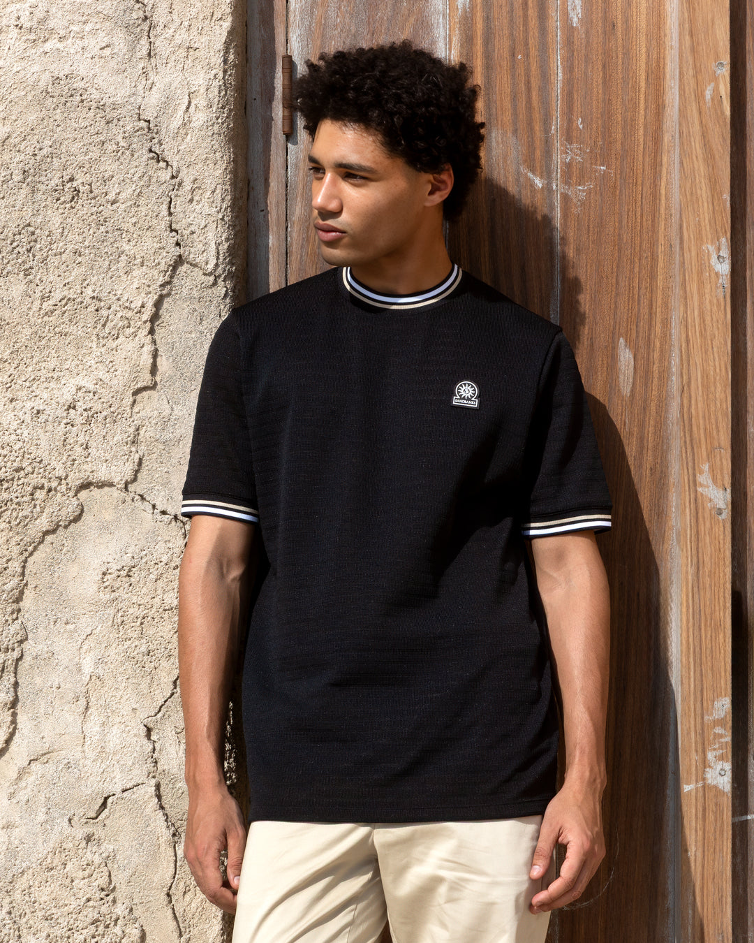 Model wearing Black Summer Sandbanks T-shirt 