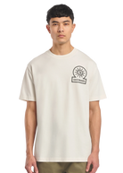 Model wearing a beige t-shirt with a logo on a white background