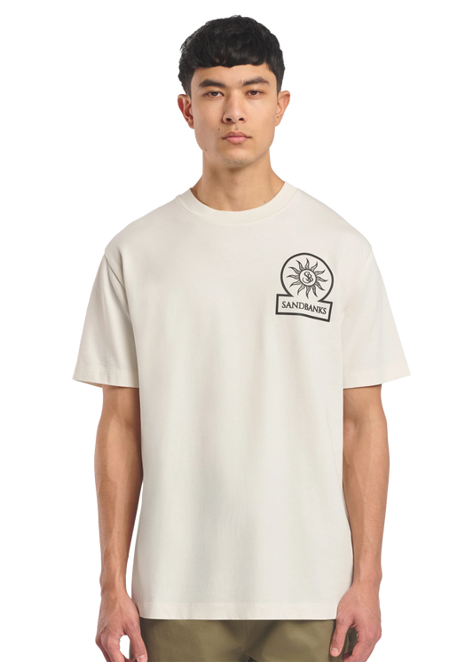 Model wearing a beige t-shirt with a logo on a white background