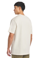 Model wearing a plain white t-shirt on a white background