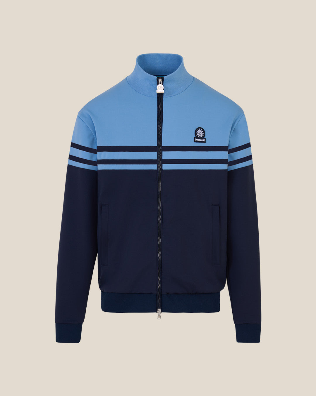 Two-tone blue jacket with a logo on a beige background