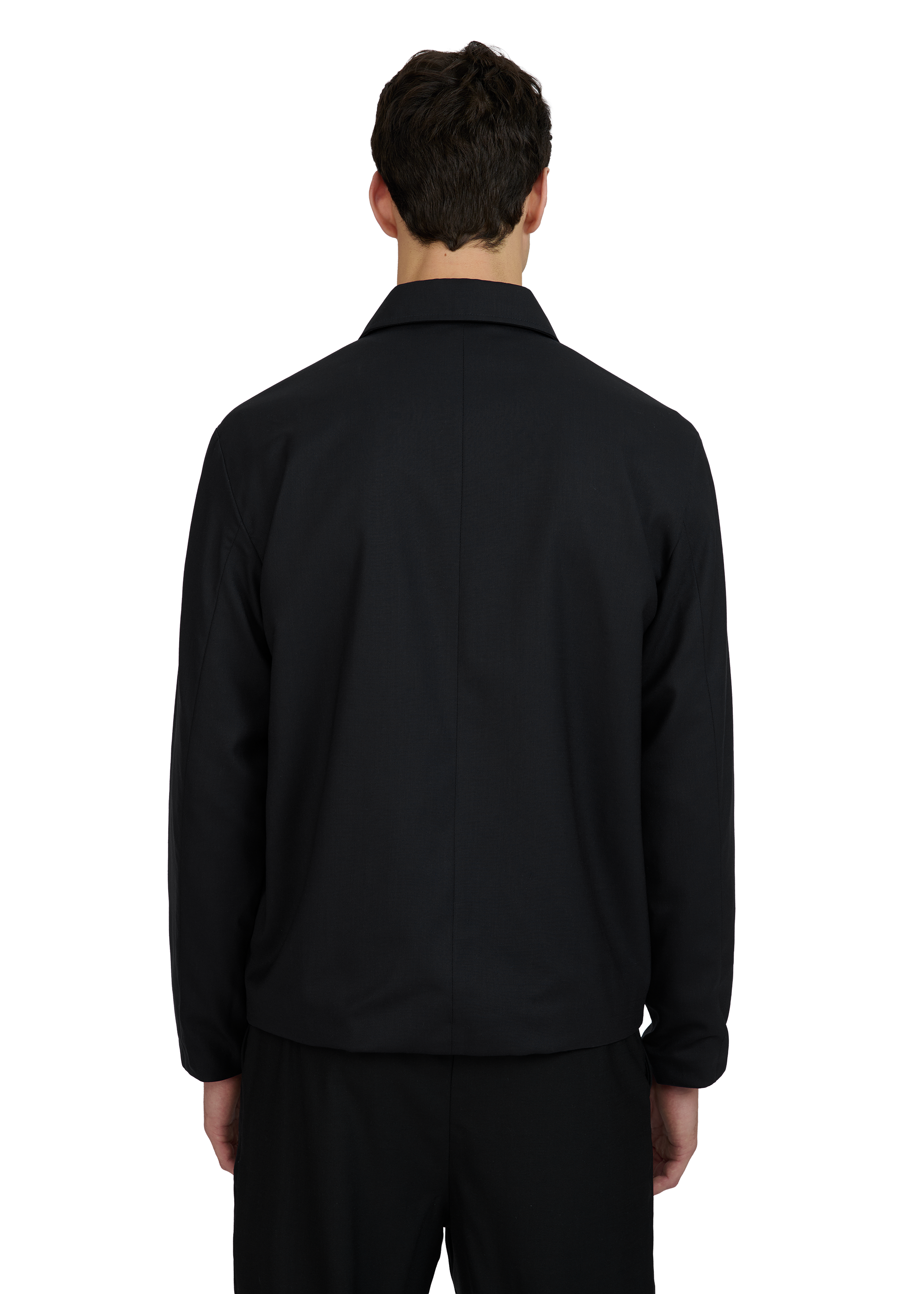 Person wearing a black jacket on a white background
