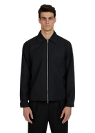 Man wearing a black jacket on a white background