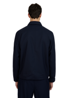Person wearing a navy blue jacket on a white background