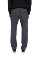 Person wearing gray pants on a white background