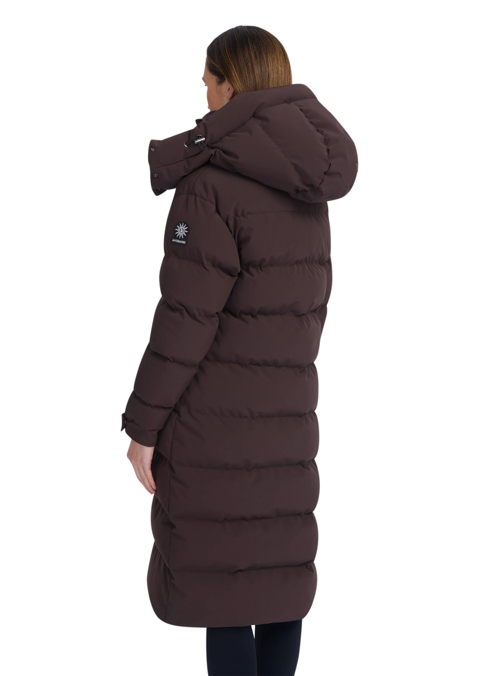 Brown puffer coat worn by a person on a white background