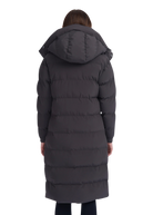 Person wearing a long dark gray puffer coat with a hood on a white background