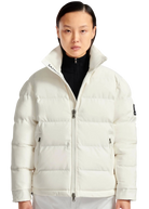 Person wearing a white puffer jacket with a brand logo on a white background