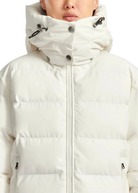 White puffer jacket with a hood worn by a person on a white background
