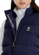 Navy puffer vest with Sandbanks branding on a white background