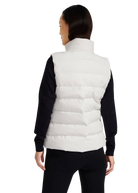 Person wearing a white puffer vest over a black long-sleeve shirt on a white background